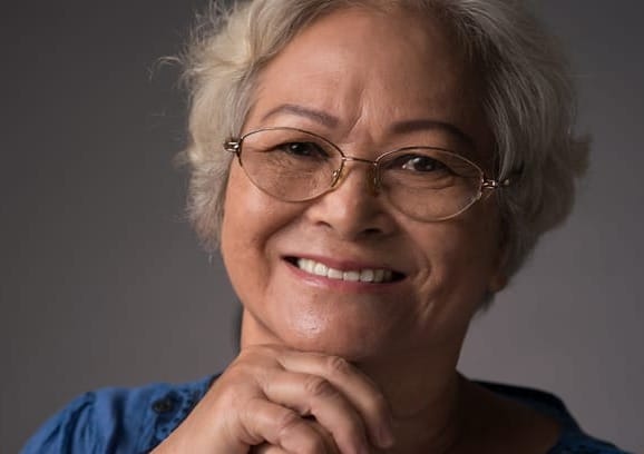 Woman smiling as she learns to breathe freely again